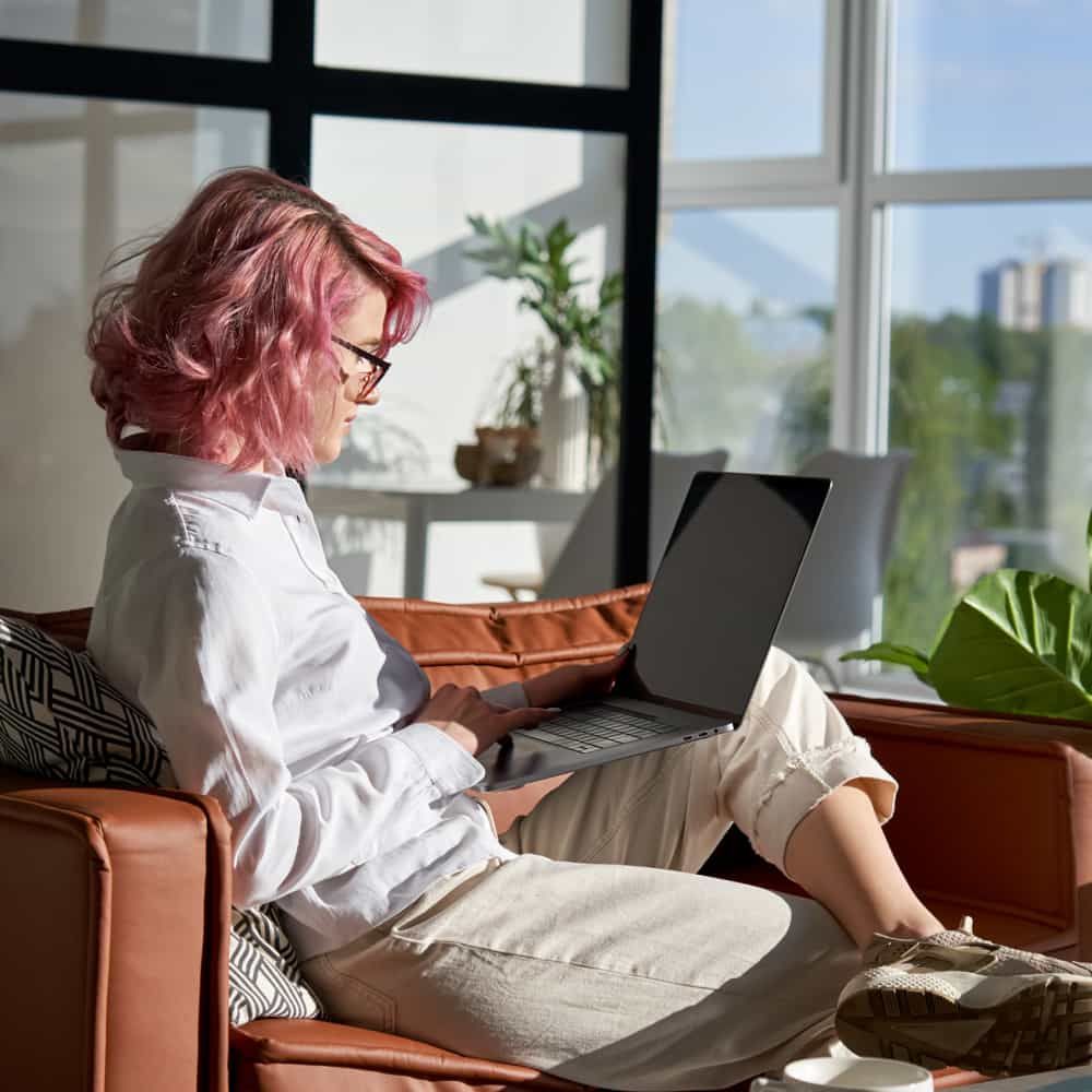 Woman sitting at home using her computer